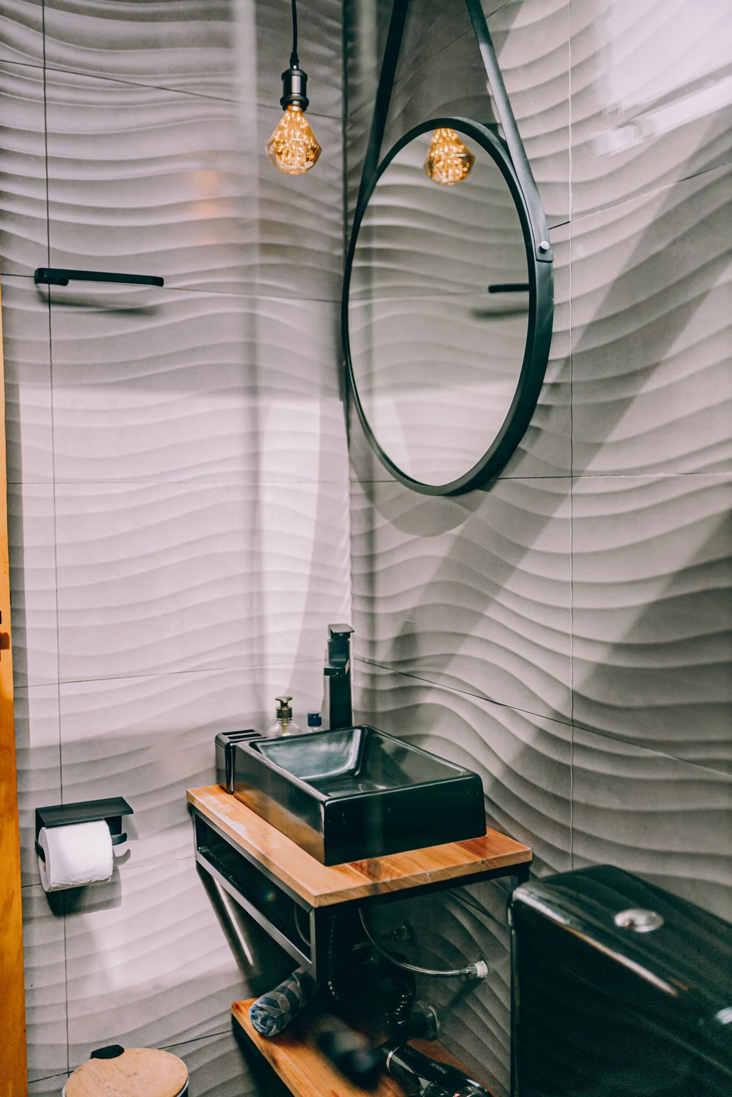 Elegant modern bathroom with wooden accents and unique lighting