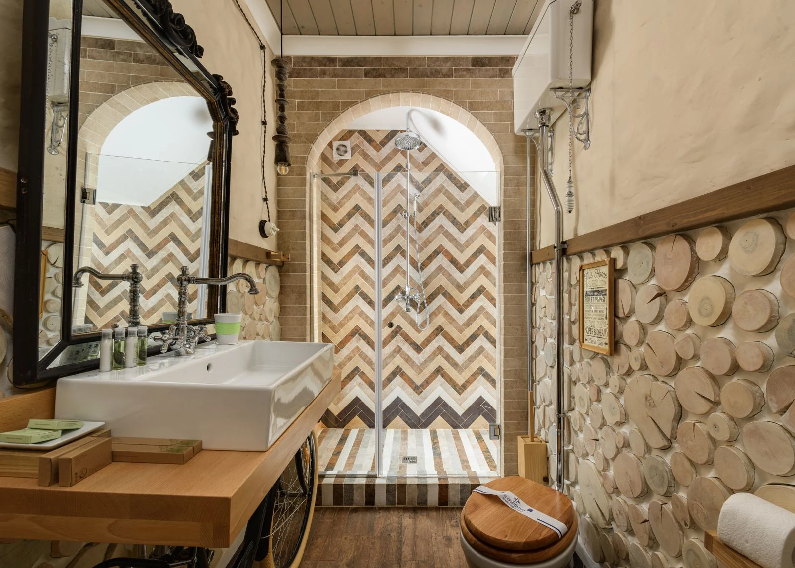 Stylish rustic bathroom featuring a herringbone shower design and natural elements